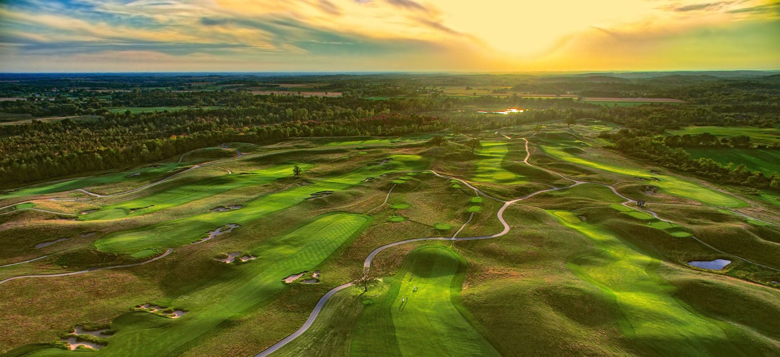 An aerial view of the Erin Hills Golf Course at sunrise